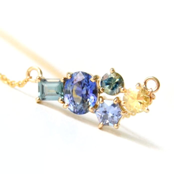 cluster necklace with sapphires set in 18k yellow gold