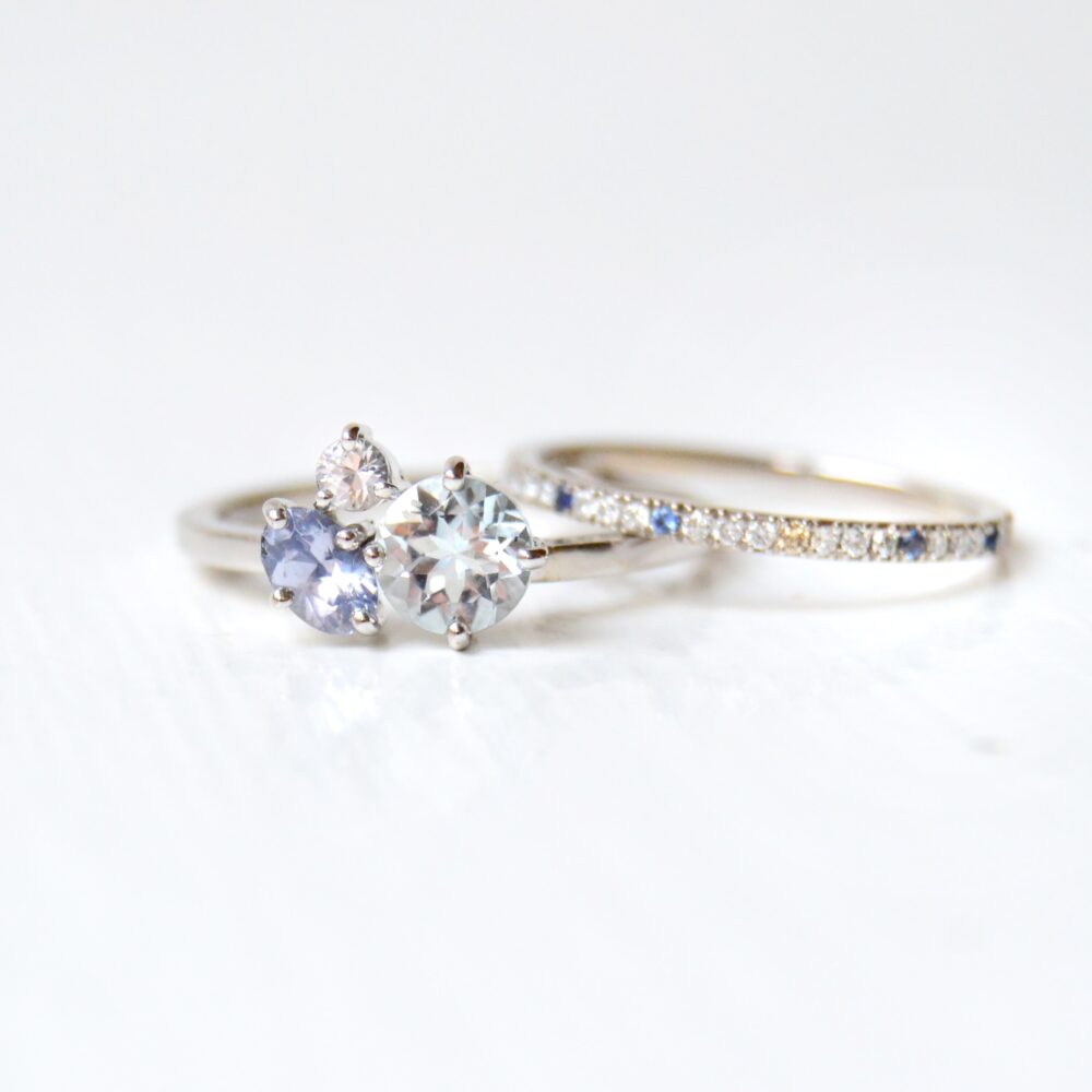 aquamarine ring stack with sapphires and diamonds set in 18K white gold.