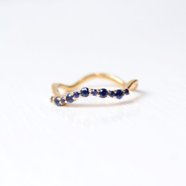 blue sapphire wave ring in 14K yellow gold.