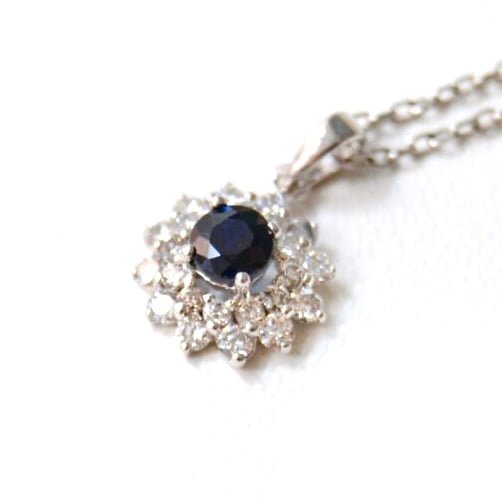 heirloom necklace with blue sapphire and diamonds set in 18k white gold