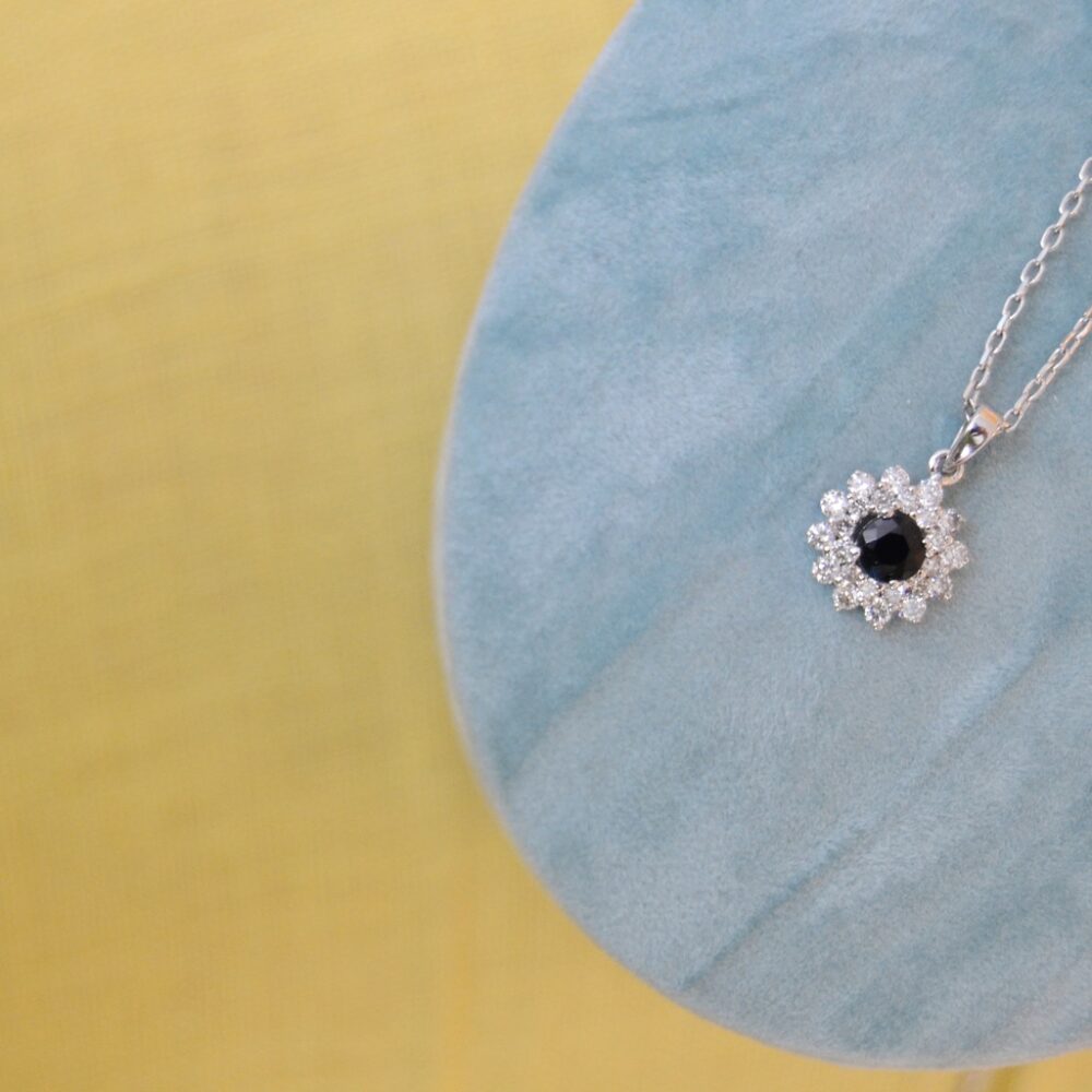 Heirloom necklace with blue sapphire