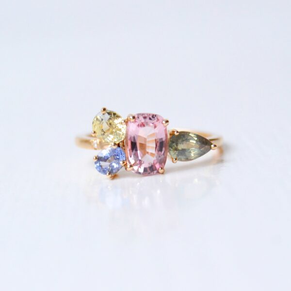 cluster ring with tourmaline, chrysoberyl and sapphires set in 18K yellow gold.