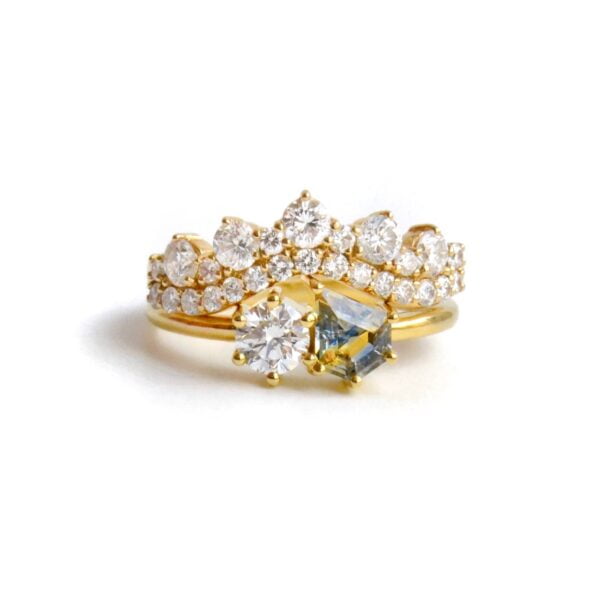Toi et moi ring stack with an incredible bi-color sapphire and loads of VS1 diamonds set in 14K and 18K yellow gold.