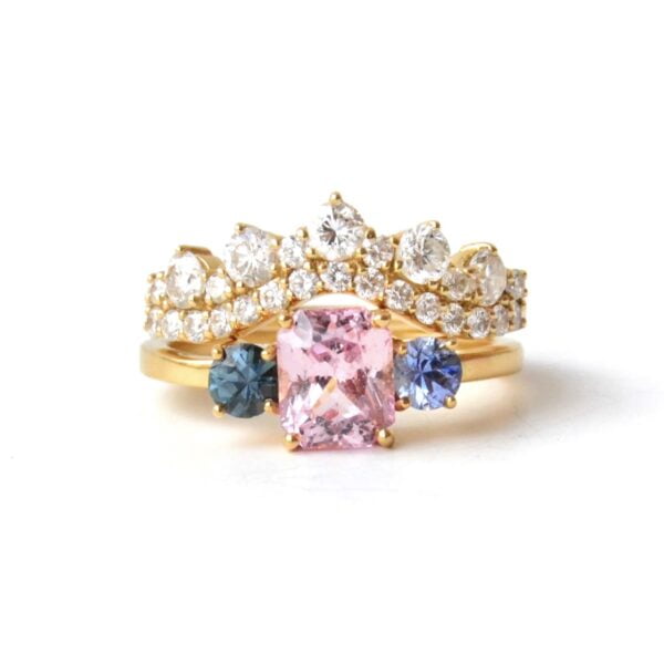 Three stone ring stack with sapphires and diamonds set in yellow gold