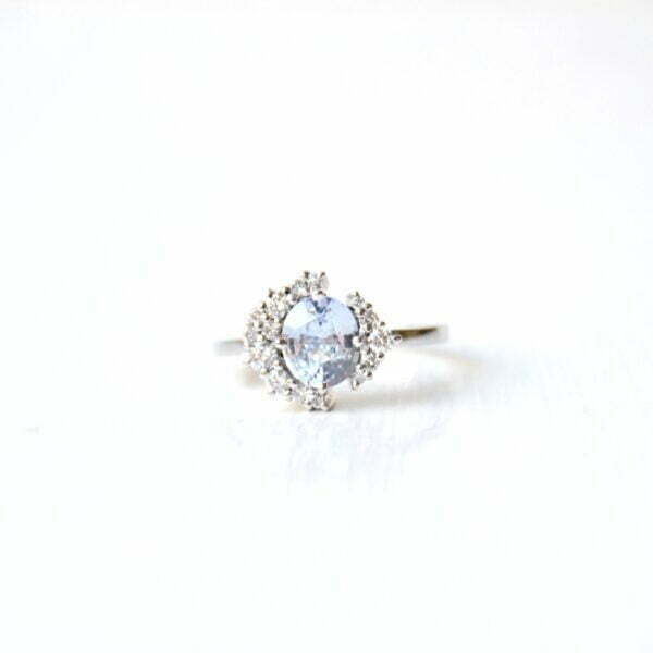 Baby blue sapphire ring with VS1 diamonds set in 18K white gold.