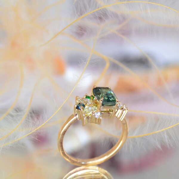 Green sapphire cluster ring with diamonds