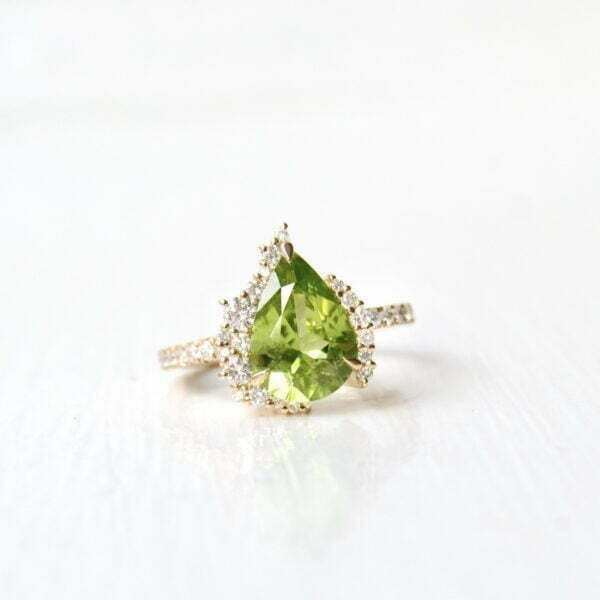 peridot ring with diamonds, ruby and sapphire set in 18 yellow gold.