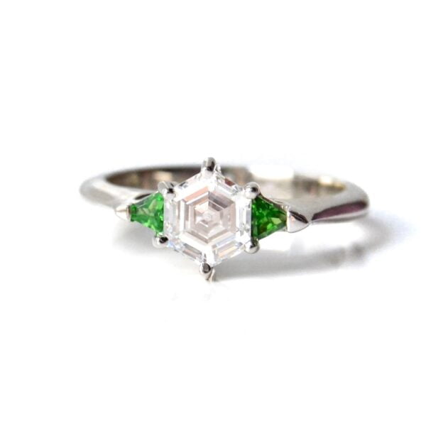 Custom made lab grown diamond three stone ring with tsavorites set in platinum