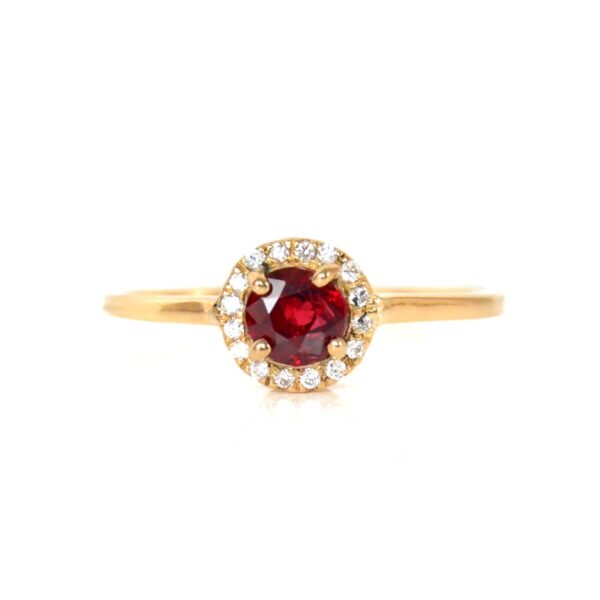 Ruby halo ring with diamonds set in 18k yellow gold