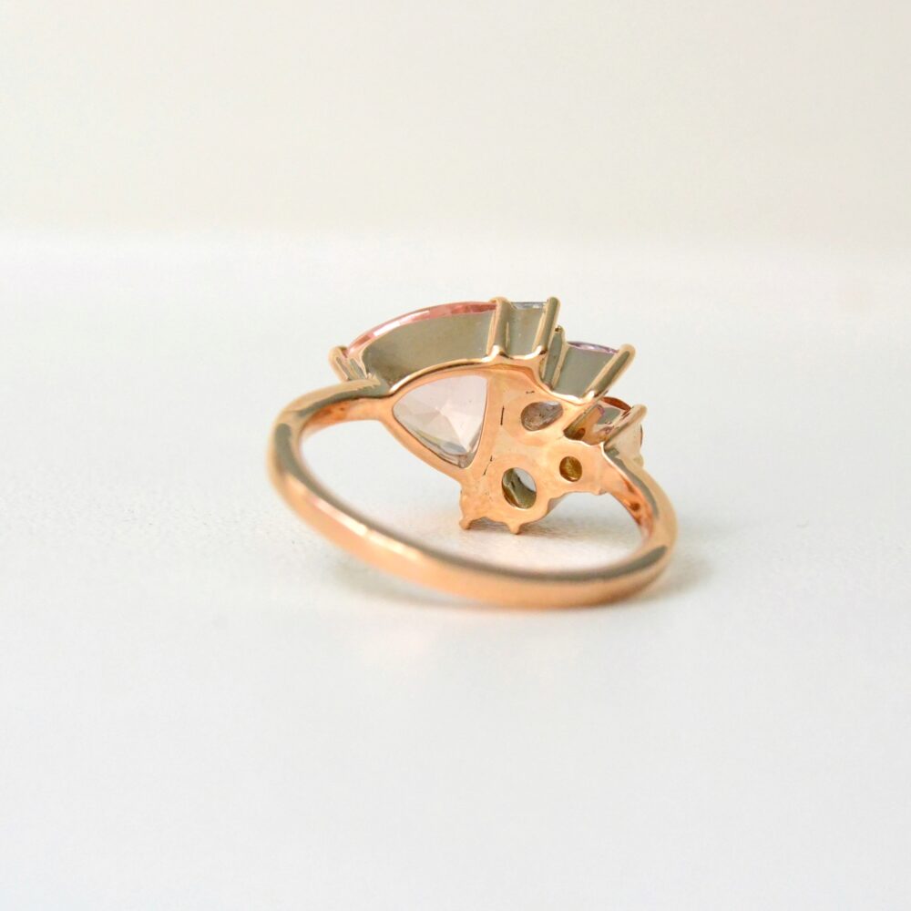 Peach cluster ring with sapphires set in 18K rose gold