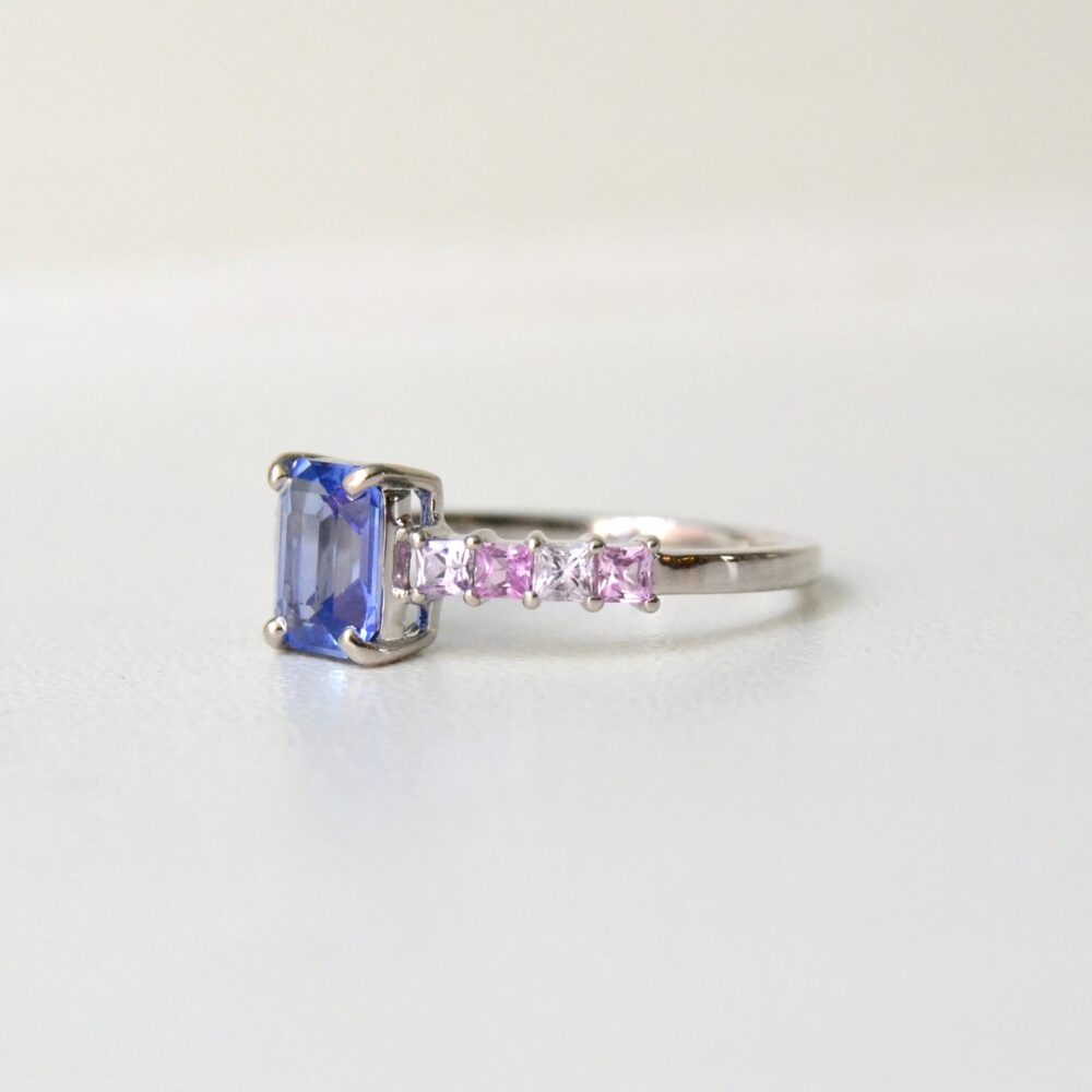 Blue sapphire ring with pink and lavender sapphires set in 18K white gold