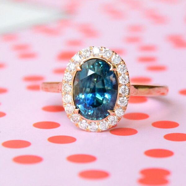 Teal sapphire halo ring