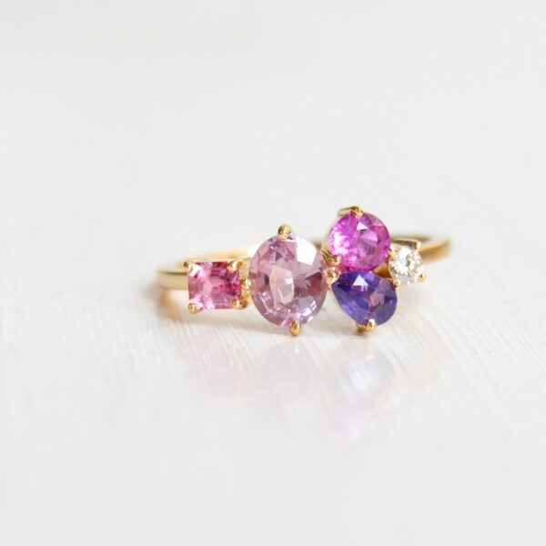 pink cluster ring with sapphires and diamond set in 18K yellow gold.